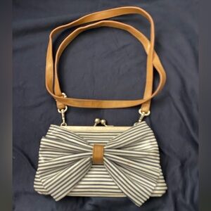 Stylish Blue and Tan Crossbody Bag with Decorative Bow